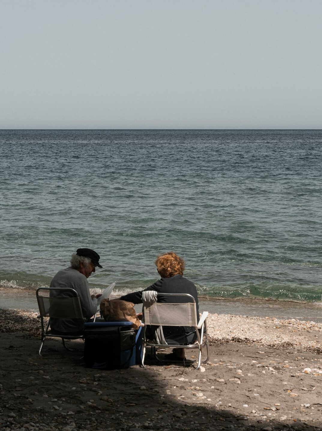 retired couple on beach