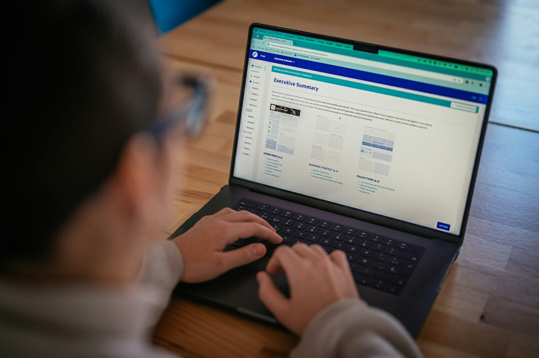 person using budget calculator on laptop