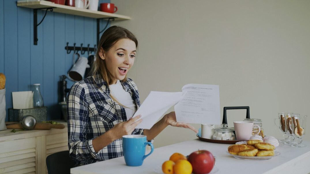 woman calculating expenses at home